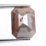 Natural diamond in raw and polished form displaying true earth-mined characteristics. This diamond highlights natural inclusions, clarity variations