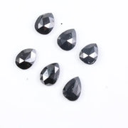 Buy 1.59 CT Natural Pear Fancy Black Diamond, what does a raw diamond look like, how to identify a raw diamond, offering diamods, lab grown vs natural diamond, man made diamond rings, how to tell if a diamond is real.