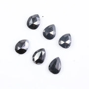 Buy 1.59 CT Natural Pear Fancy Black Diamond, what does a raw diamond look like, how to identify a raw diamond, offering diamods, lab grown vs natural diamond, man made diamond rings, how to tell if a diamond is real.