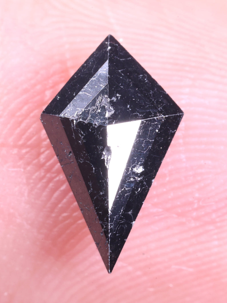 Black diamond on a finger