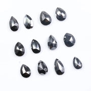 Natural Pear Cut Fancy Black Diamond Engagement Ring, how can you tell if a diamond is real, diamonds in the rough, raw diamonds, lab grown vs natural diamond, natural diamond vs lab grown.