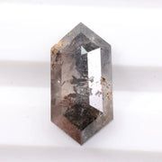 Collection of natural diamonds including oval, elongated cushion, and Dutch marquise cuts. Shows real diamonds formed deep within the earth