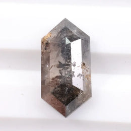 Collection of natural diamonds including oval, elongated cushion, and Dutch marquise cuts. Shows real diamonds formed deep within the earth