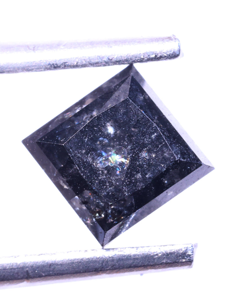 Square-cut diamond with a stick on a white background