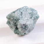 Irregular diamond shape raw diamond stone featuring smooth diamonds areas and rough crystal edges. This rough uncut diamond is perfect for loose diamond buyers