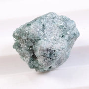 Irregular diamond shape raw diamond stone featuring smooth diamonds areas and rough crystal edges. This rough uncut diamond is perfect for loose diamond buyers