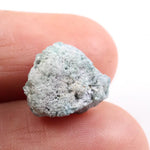 Irregular diamond shape raw diamond stone featuring smooth diamonds areas and rough crystal edges. This rough uncut diamond is perfect for loose diamond buyers