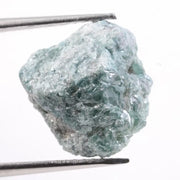 Irregular diamond shape raw diamond stone featuring smooth diamonds areas and rough crystal edges. This rough uncut diamond is perfect for loose diamond buyers