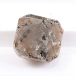 Rough natural diamond shown in its raw uncut form, revealing authentic crystal structure formed over billions of years.