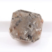 Rough natural diamond shown in its raw uncut form, revealing authentic crystal structure formed over billions of years.