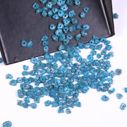 raw uncut diamond showing what does diamond look like before it is cut with natural blue diamond blue diamond stud earrings and blue diamond wedding band black faceted diamond