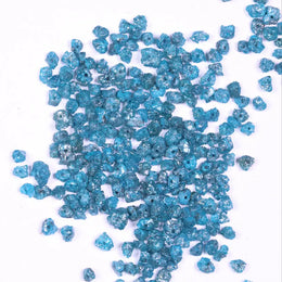 raw uncut diamond showing what does diamond look like before it is cut with natural blue diamond blue diamond stud earrings and blue diamond wedding band black faceted diamond
