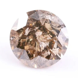 round three stone diamond ring, round versus cushion cut diamond, rounded square diamond ring, wedding band with round and baguette diamonds, black faceted diamond