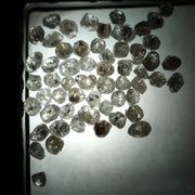 Natural grey white rough diamond lot with mixed silver smoky tones, raw uncut loose diamond crystals displayed on white background.