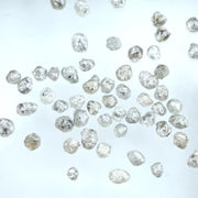 Natural grey white rough diamond lot with mixed silver smoky tones, raw uncut loose diamond crystals displayed on white background.