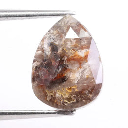 Natural diamond jewelry including rings, earrings, and bracelets displayed to explain price differences between natural and lab grown diamonds.