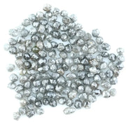 Mixed silver smoky raw uncut loose diamond crystals in natural grey and translucent white tones, rough earth-mined diamonds for jewelry making.