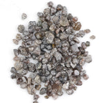 brown grey natural diamond with an untreated rough surface for jewelry creation