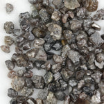 brown grey natural diamond with an untreated rough surface for jewelry creation