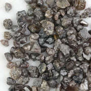 brown grey natural diamond with an untreated rough surface for jewelry creation