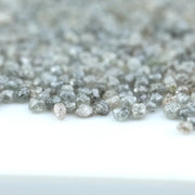 Natural gray silver diamond rough crystal with metallic shine and raw uncut texture