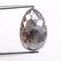 Natural diamonds displayed in various cuts and colors, showcasing real earth-mined gemstones formed over billions of years.