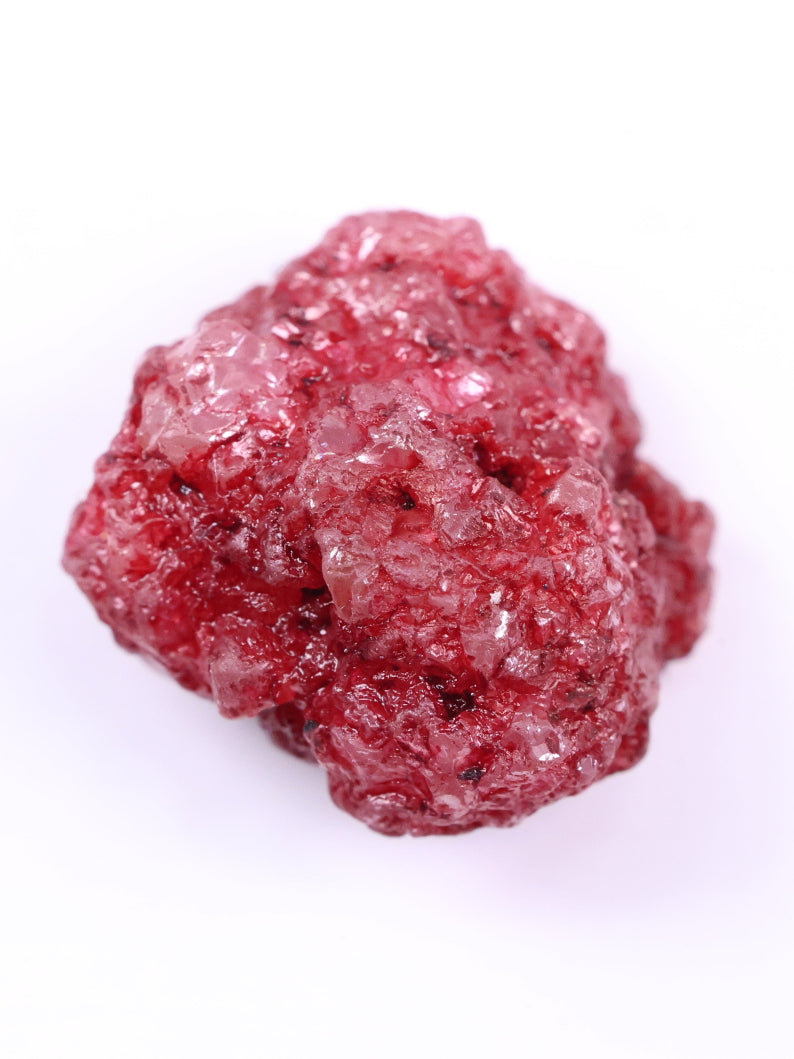 Red color diamond rock on a white background