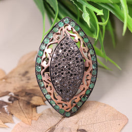 Victorian marquise black diamond ring with an emerald halo in a sterling silver cocktail setting.