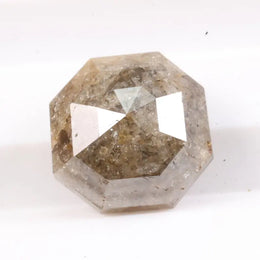 Raw natural diamond in rock showing uncut crystal formation as found in nature. Authentic earth-mined rough diamond before polishing and cutting.