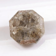 Raw natural diamond in rock showing uncut crystal formation as found in nature. Authentic earth-mined rough diamond before polishing and cutting.