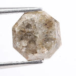 Raw natural diamond in rock showing uncut crystal formation as found in nature. Authentic earth-mined rough diamond before polishing and cutting.