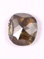 Faceted brown gemstone on a white background
