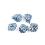 Rare deep blue diamond set in a custom ring, highlighting brilliance and luxury.