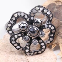 Decorative brooch with gemstones on a leaf