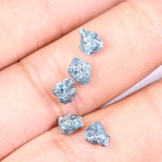 Rare deep blue diamond set in a custom ring, highlighting brilliance and luxury.