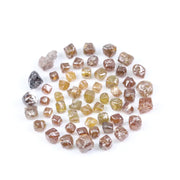 Fancy multi color raw natural diamond lot featuring yellow, brown and golden rough uncut stones