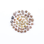 Fancy multi color raw natural diamond lot featuring yellow, brown and golden rough uncut stones