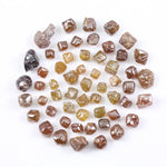Fancy multi color raw natural diamond lot featuring yellow, brown and golden rough uncut stones