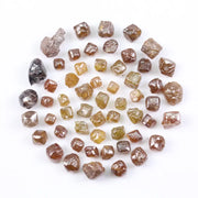 Fancy multi color raw natural diamond lot featuring yellow, brown and golden rough uncut stones