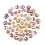 Fancy multi color raw natural diamond lot featuring yellow, brown and golden rough uncut stones
