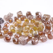 Fancy multi color raw natural diamond lot featuring yellow, brown and golden rough uncut stones