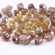 Fancy multi color raw natural diamond lot featuring yellow, brown and golden rough uncut stones