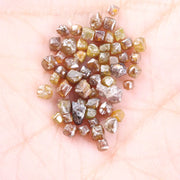 Fancy multi color raw natural diamond lot featuring yellow, brown and golden rough uncut stones