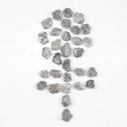 Raw gray silver diamond with shimmering steel-toned surface for custom jewelry