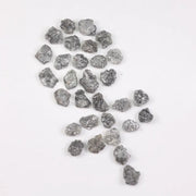 Raw gray silver diamond with shimmering steel-toned surface for custom jewelry