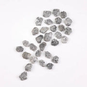 Raw gray silver diamond with shimmering steel-toned surface for custom jewelry