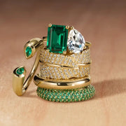 Elegant gemstone ring featuring vibrant center stone with sparkling accents, perfect for engagement or daily wear