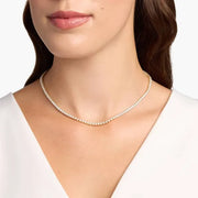 12.06 Ct gold cross necklace with polished finish.