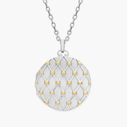 Jade with gold necklace featuring green gemstone pendant.