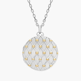 Jade with gold necklace featuring green gemstone pendant.